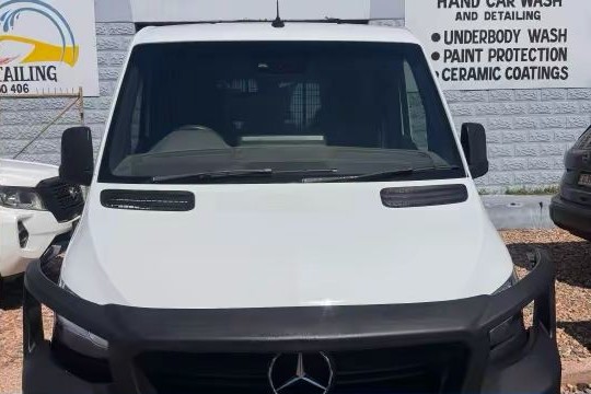 After — clean white van front end