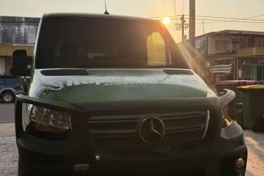 Before — green wrapped van front end