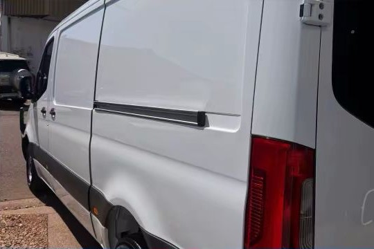 After — clean white van side and rear quarter panel